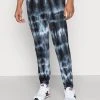 YOURTURN MONOCHROME TIE DYE JOGGER UNISEX - Pantaloni Sportivi - Black/off White -Youturn Abbigliamento Negozio 0edc31c01d024468a27152acd4fe8944